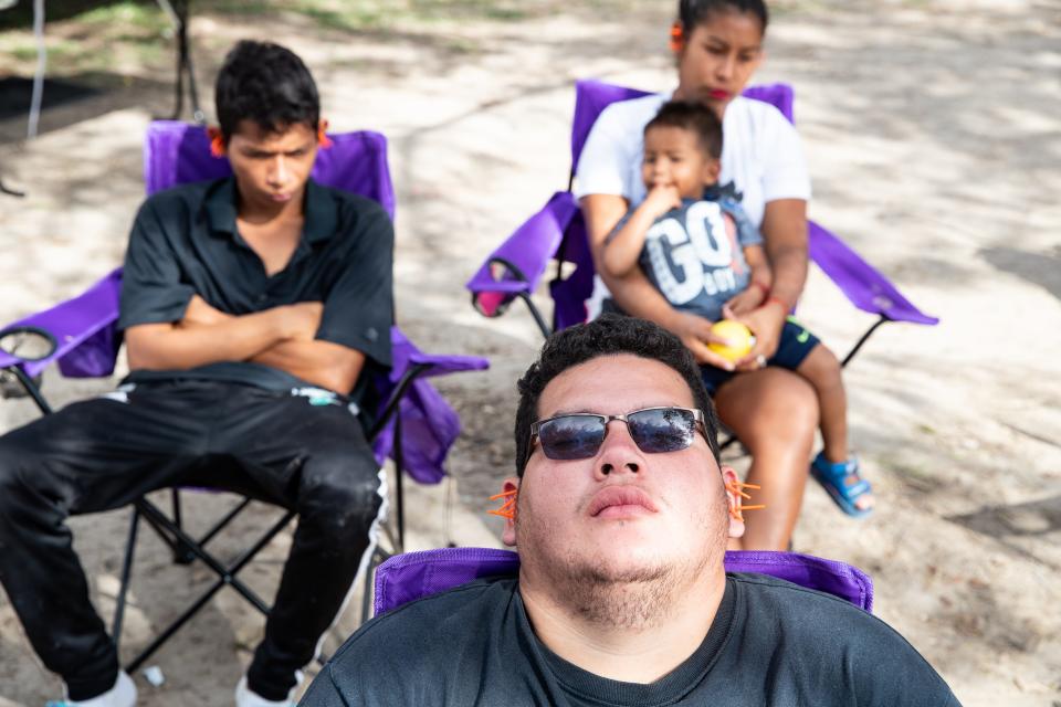 Migrants receive acupuncture treatments from volunteers with Acupuncturists Without Borders inside the migrant camp in Matamoros, Mexico, along the U.S. border.