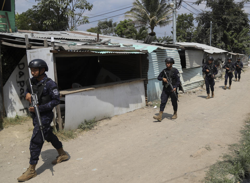 Airmen of the Salvadoran Air Force patrol in the December 1 neighborhood of Soyapango, El Salvador, Thursday, March 2, 2023. El Salvador's congress has approved President Bukele's request to extend the period of special powers for another month, meaning the country will go at least a full year with some fundamental rights suspended in its fight against gangs. (AP Photo/Salvador Melendez)