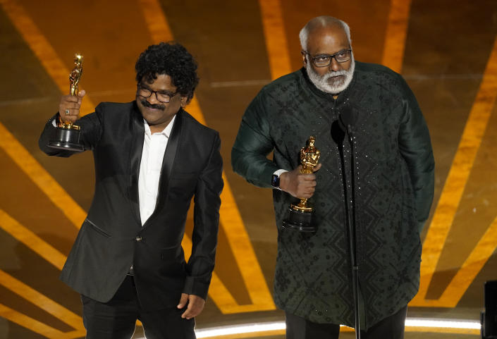 M.M. Keeravaani, right, and Chandrabose accept the award for best original song for "Naatu Naatu" from "RRR" at the Oscars on Sunday, March 12, 2023, at the Dolby Theatre in Los Angeles. (AP Photo/Chris Pizzello)