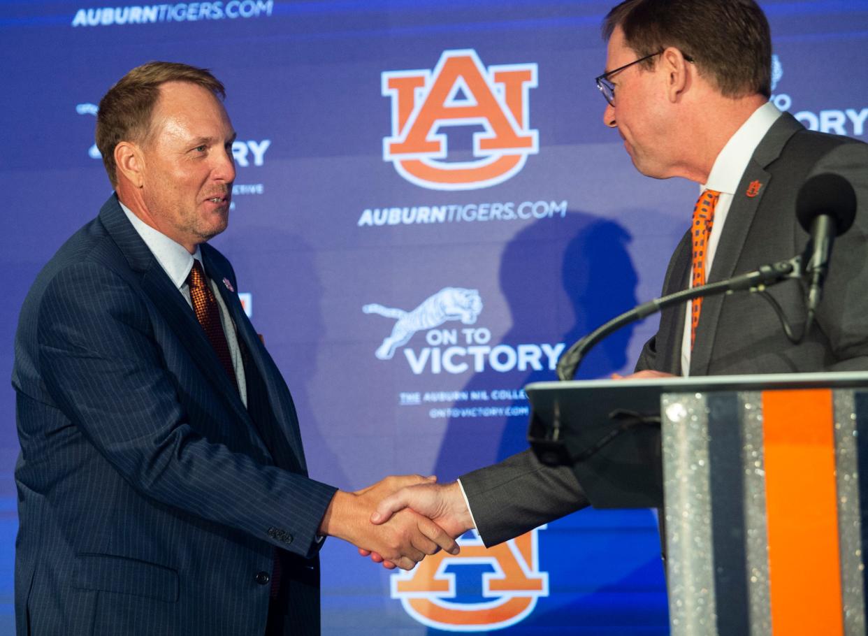 Auburn athletic director John Cohen introduces Auburn Tigers football coach Hugh Freeze at the Woltosz Football Performance Center in Auburn, Ala., on Tuesday, Nov. 29, 2022