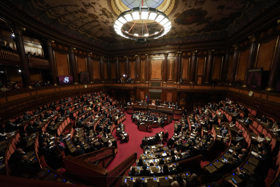 Senators listen to Italian Premier Mario Draghi's speech at the Senate in Rome, Wednesday, July 20, 2022. Draghi was deciding Wednesday whether to confirm his resignation or reconsider appeals to rebuild his parliamentary majority after the populist 5-Star Movement triggered a crisis in the government by withholding its support. (AP Photo/Andrew Medichini)