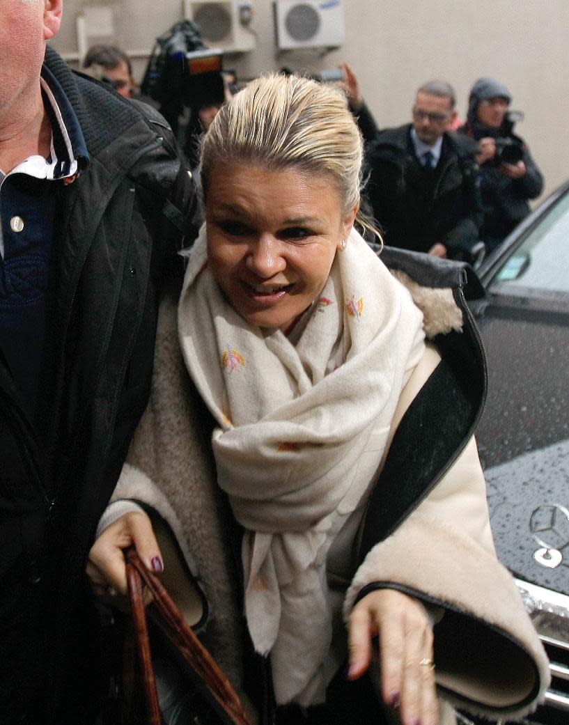 Michael Schumacher's wife, Corinna arrives at the Grenoble hospital, French Alps, Saturday, Jan. 4, 2014, where former seven-time Formula One champion Michael Schumacher is being treated after sustaining a head injury during a ski accident. Schumacher has been in a medically induced coma since Sunday, when he struck his head on a rock while on a family vacation. (AP Photo/Claude Paris)