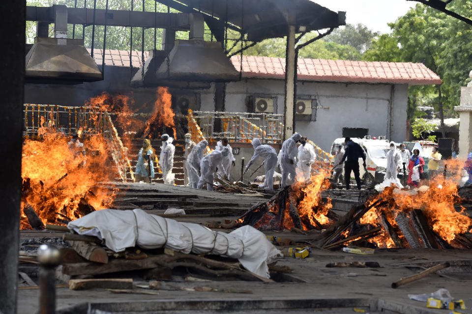 NEW DELHI, INDIA  APRIL 23: A view of multiple funeral pyres of Covid-19 victims, at Nigambodh Ghat crematorium, on April 23, 2021 in New Delhi, India. (Photo by Sanjeev Verma/Hindustan Times via Getty Images)