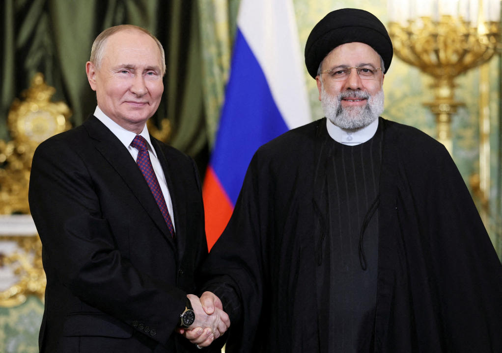 FILE PHOTO: Russian President Vladimir Putin shakes hands with Iranian President Ebrahim Raisi during a meeting in Moscow, Russia December 7, 2023. Sputnik/Sergei Bobylev/Pool via REUTERS/File Photo ATTENTION EDITORS - THIS IMAGE WAS PROVIDED BY A THIRD PARTY.