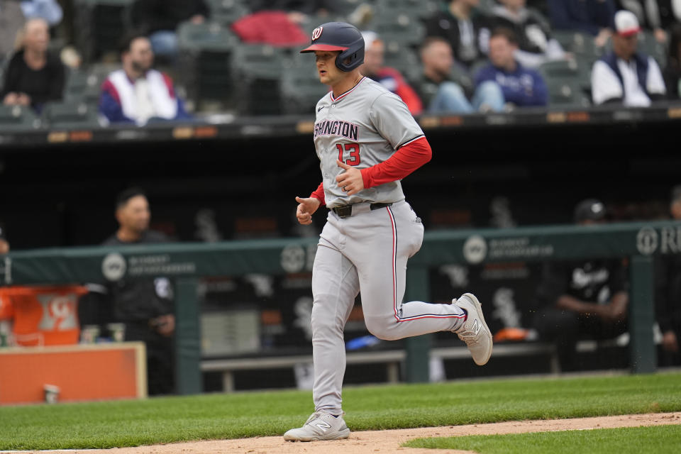 Washington Nationals' Nick Senzel scores on a single from Trey Lipscomb during the eighth inning in the first baseball game of a doubleheader against the Chicago White Sox, Tuesday, May 14, 2024, in Chicago. (AP Photo/Erin Hooley)