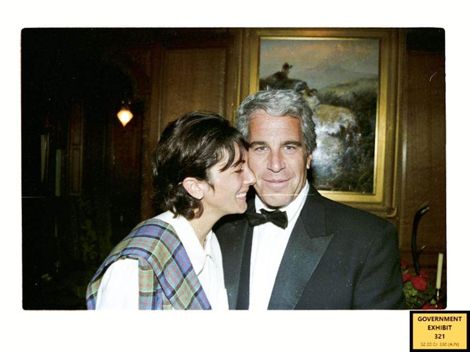 Ghislaine Maxwell, smiling, presses her nose against Jeffrey Epstein's face as he looks at the camera.