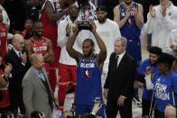 Kawhi Leonard of the Los Angeles Clippers holds up his NBA All-Star Game Kobe Bryant MVP Award after the NBA All-Star basketball game Sunday, Feb. 16, 2020, in Chicago. (AP Photo/David Banks)