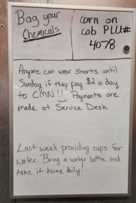 A whiteboard with notes: "Bag your chemicals," "corn on cob PLU# 4078," shorts allowed for $2/day to CMN, pay at Service Desk, bring own water bottle, no cups next week