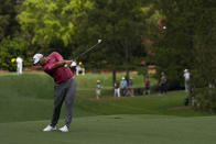 Jon Rahm, of Spain, hits on the fifth hole during the final round of the Masters golf tournament on Sunday, April 11, 2021, in Augusta, Ga. (AP Photo/Gregory Bull)