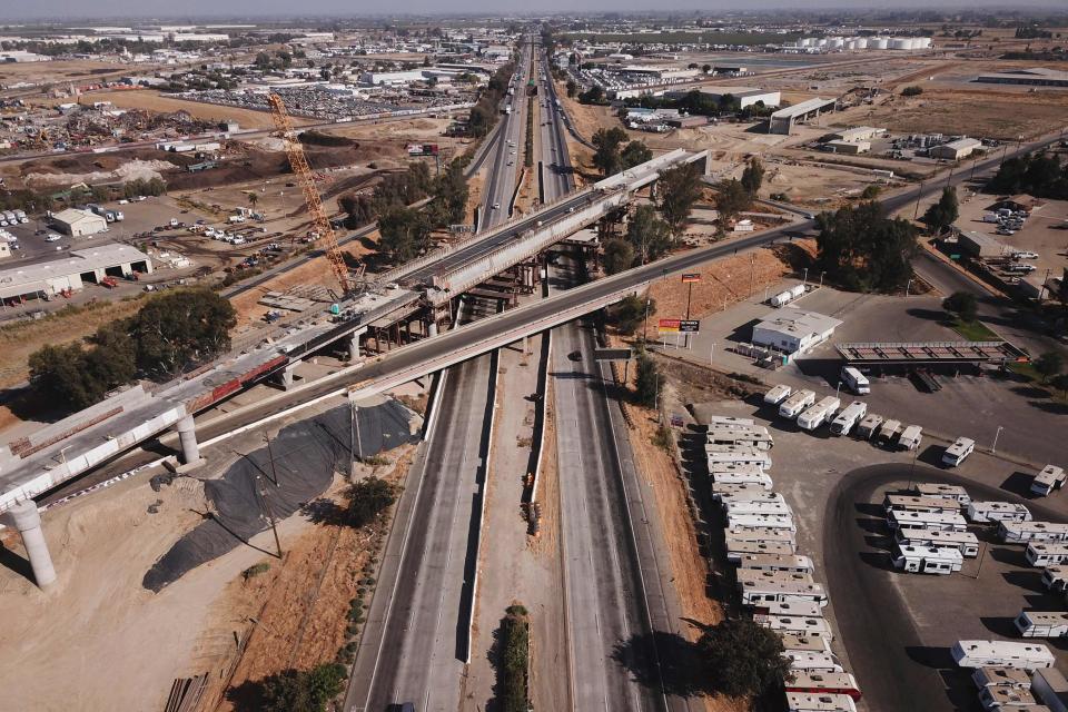 In this aerial image taken on Aug. 26, 2021, the Cedar viaduct stands during construction of a high-speed rail project over State Route 99 through the Central Valley in Fresno, Calif. The Senate passed a bipartisan infrastructure development bill that would see a $1.2 trillion investment in roads, bridges, water pipes and high-speed internet across the United States.