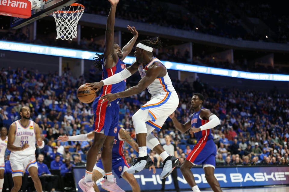 Oct 19, 2023; Tulsa, Oklahoma, USA; Oklahoma City Thunder guard Luguentz Dort (5) passes around Detroit Pistons center <a class="link " href="https://sports.yahoo.com/nba/players/6408" data-i13n="sec:content-canvas;subsec:anchor_text;elm:context_link" data-ylk="slk:Isaiah Stewart;sec:content-canvas;subsec:anchor_text;elm:context_link;itc:0">Isaiah Stewart</a> (28) in the second half at BOK Center. Mandatory Credit: Joey Johnson-USA TODAY Sports