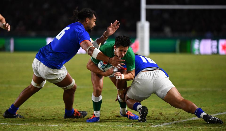 Ireland's fly-half Joey Carbery is tackled by Samoa's flanker Chris Vui. (Credit: Getty Images)