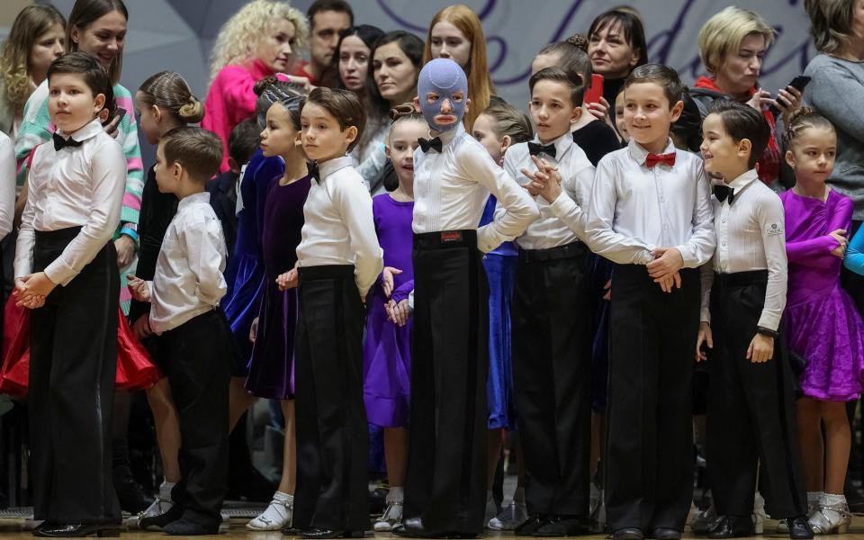 Roman Oleksiv in line with other children at a dance contest