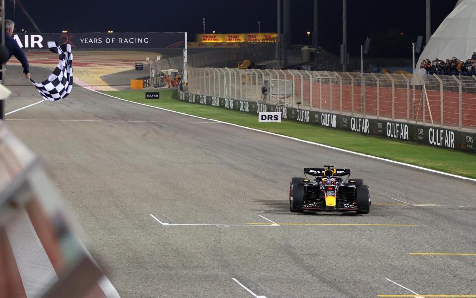 Red Bull Racing's Dutch driver Max Verstappen crosses the finish line to win the Bahrain Formula One Grand Prix at the Bahrain International Circuit in Sakhir on March 2, 2024.