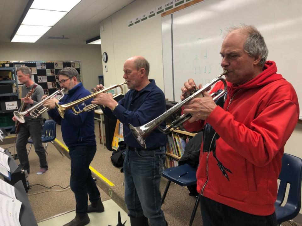 From right, Ben Webber, Al Jones, Sean Daly and Allan Yeoman practise for the Ragged Ass Swing Band's upcoming show at the Top Knight. (Meaghan Brackenbury/CBC - image credit)