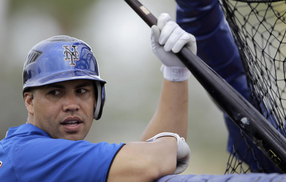 FILE - In this Thursday, Feb. 24, 2011 file photo, New York Mets' Carlos Beltran waits to bat during spring training baseball in Port St. Lucie, Fla. A person familiar with the decision tells The Associated Press the New York Mets have decided to hire Carlos Beltrán as their manager. The person spoke on condition of anonymity Friday, Nov. 1, 2019 because the team has not made an announcement. (AP Photo/Lynne Sladky, File)