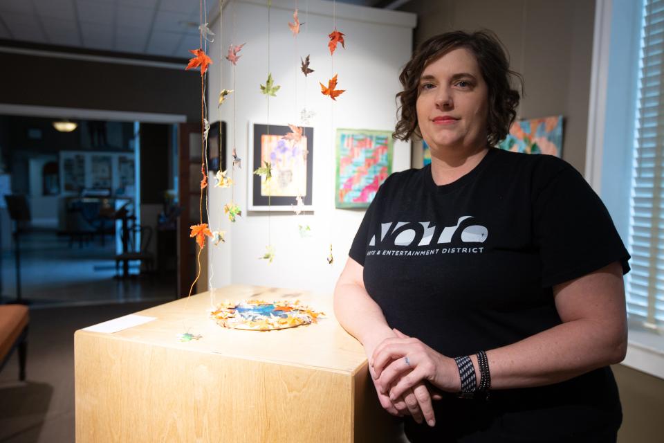 Staci Ogle, program and communications coordinator for Noto Arts and Entertainment District, stands Friday in the Morris Gallery at the NOTO Arts Center.