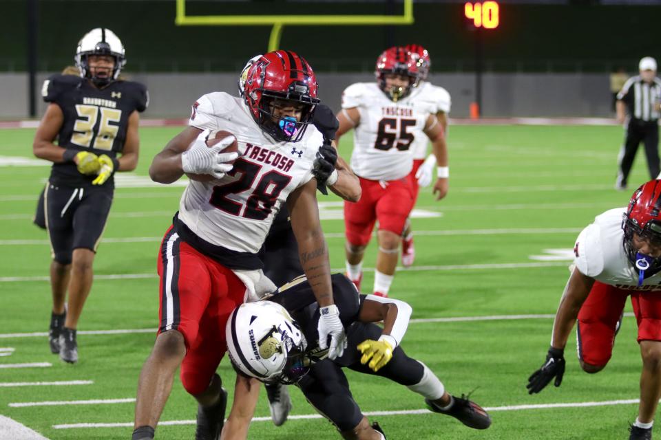 Tascosa's Treshun Wilson (28) is pushed out of bounds as he runs the ball against the Amarillo High defense during a District 2-5A Division I game, Friday, Sept. 23, 2022, at Bain-Schaeffer Buffalo Stadium in Canyon.