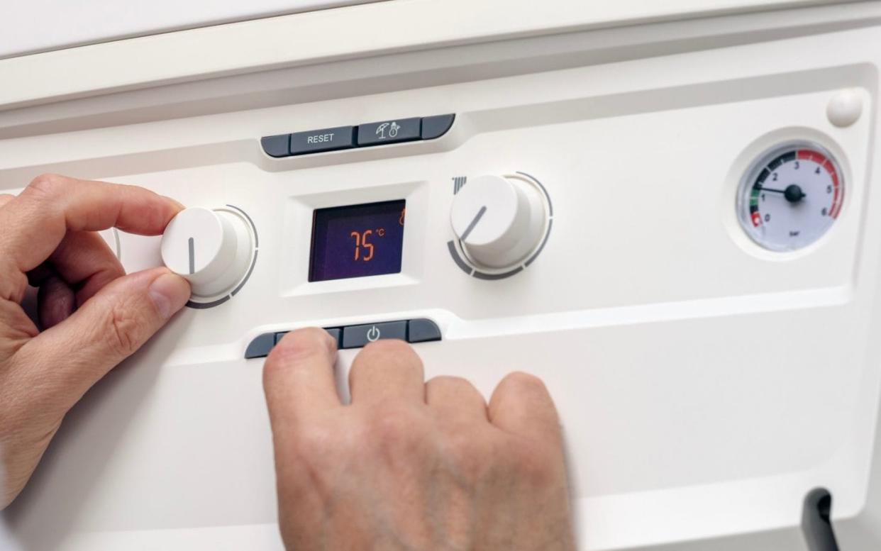 Adjusting the setting on a home boiler