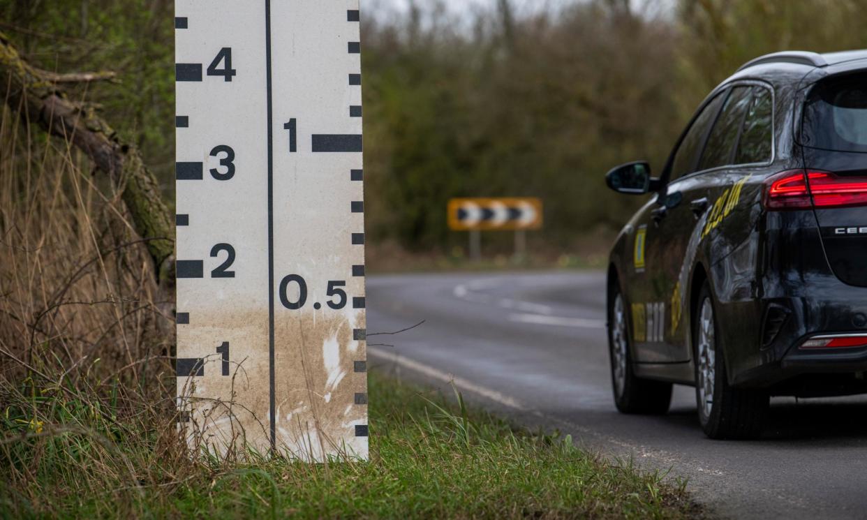<span>The Welney Wash Road in Norfolk has been closed for a record-breaking 89 days this winter because of flooding.</span><span>Photograph: Joshua Bright/The Guardian</span>