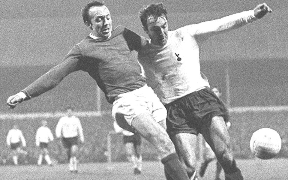 Manchester United's Nobby Stiles (left) and Tottenham Hotspur's Jimmy Greaves in a tussle for the ball during the First Division match at White Hart Lane - PA Archive