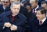 Turkey's President Tayyip Erdogan (L) chats with Prime Minister Ahmet Davutoglu during a Republic Day ceremony at Anitkabir, the mausoleum of modern Turkey's founder Ataturk, in Ankara, Turkey, October 29, 2015. REUTERS/Umit Bektas/File Photo