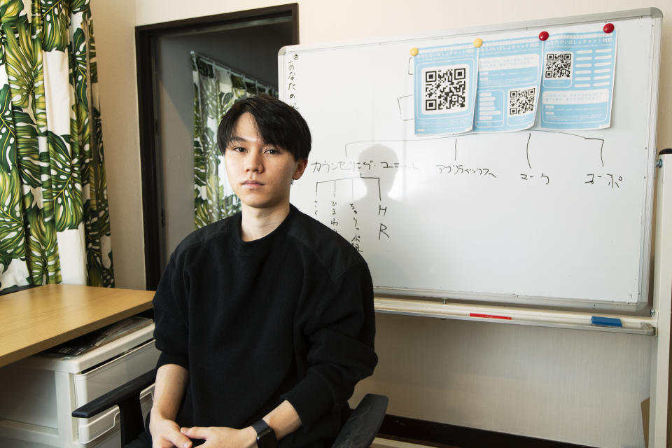 Koki Ozora, a college student who started a nonprofit called "Anata no Ibasho," or "A Place for You," poses for a photo in his office in Tokyo on Friday, Oct. 2, 2020. Suicides are on the rise among Japanese teens and that worries 21-year-old Ozora, who grew up depressed and lonely. His online Japanese-language chat service, run entirely by volunteers, offers a 24-hour text-messaging counseling for those seeking a sympathetic ear, promising to answer every request, within five seconds for urgent ones. (AP Photo/Hiro Komae)