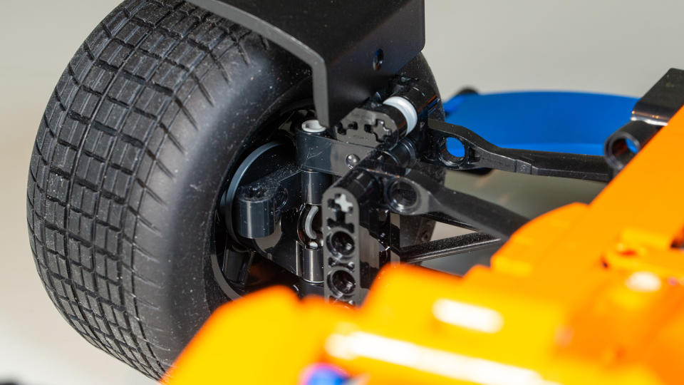 Close-up of the Lego Technic McLaren Formula 1 Race Car's working suspension