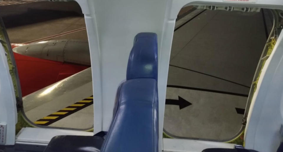 A passenger opened the emergency exit which lead to dozens of passengers spilling out onto the plane’s wing. source: Twitter/ GerryS