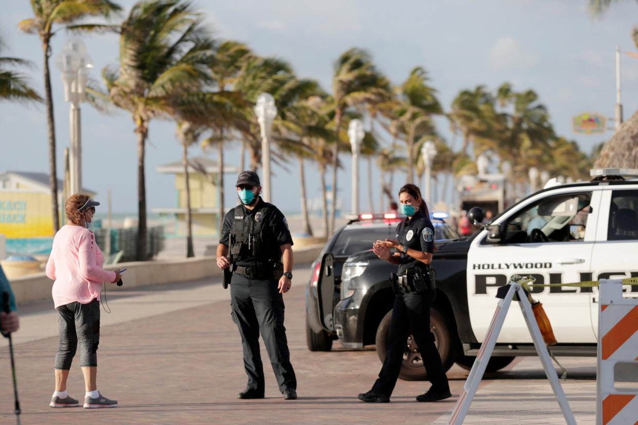 Police on Hollywood Beach Broadwalk in Florida on patrol during the coronavirus pandemic: AP