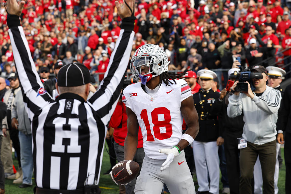 Ohio State wide receiver Marvin Harrison Jr. (18) reacts after scoring a touchdown against Rutgers during the second half of a NCAA college football game, Saturday, Nov. 4, 2023, in Piscataway, N.J. Ohio State won 35-16. (AP Photo/Noah K. Murray)