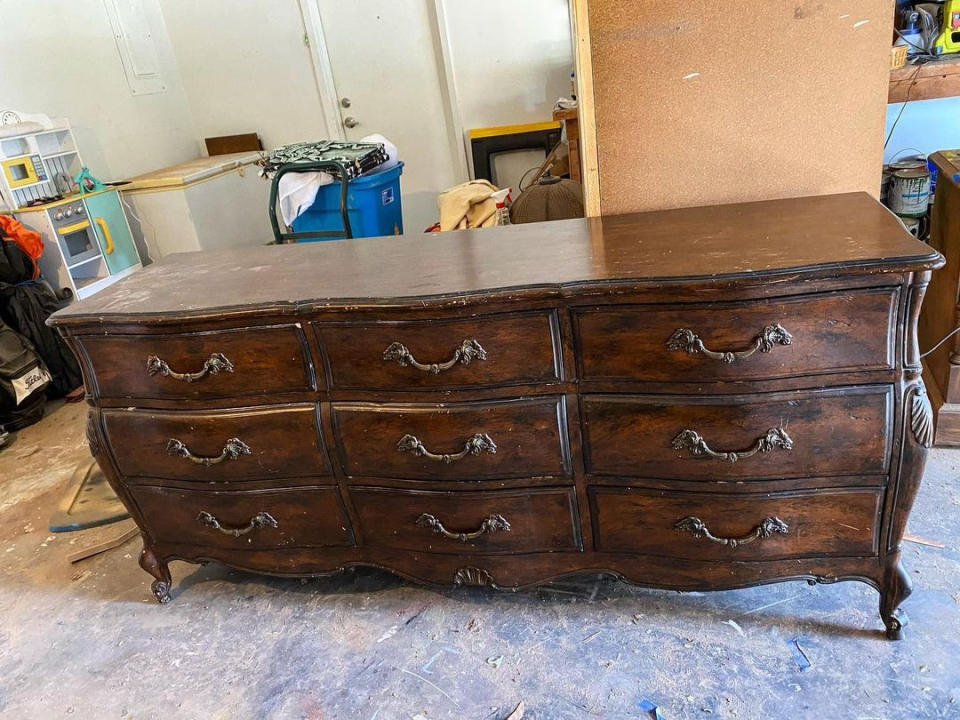 A large vintage dark wood nine-drawer buffet