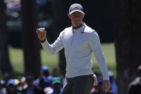 Rory McIlroy of Northern Ireland celebrates after making a birdie chip on the sixth hole in second round play during the 2017 Masters golf tournament at Augusta National Golf Club in Augusta, Georgia, U.S., April 7, 2017. REUTERS/Mike Segar