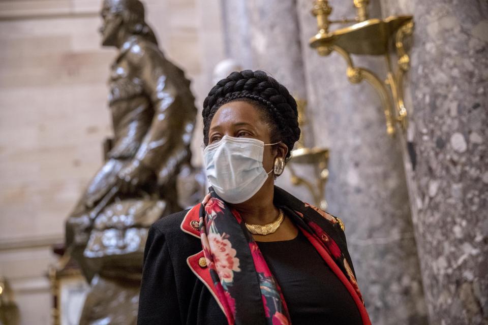 Rep. Sheila Jackson Lee, D-Texas, wears a mask and speaks to a reporter as she walks towards the House Chamber on Capitol Hill, Thursday, April 23, 2020, in Washington. The House is expected to vote on a nearly $500 billion Coronavirus relief bill. (AP Photo/Andrew Harnik)