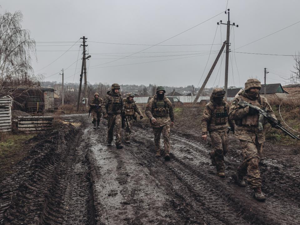 Ukrainian soldiers walk to the frontline in Bakhmut, Ukraine on December 16, 2022.