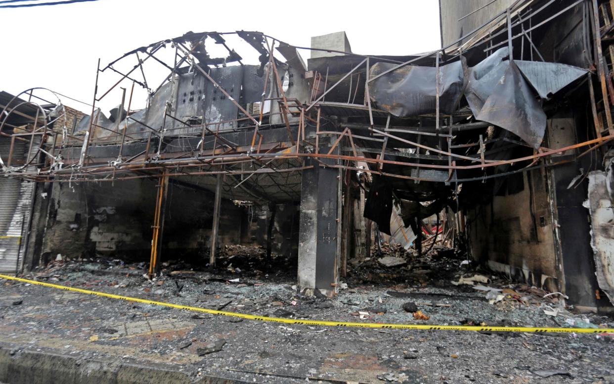 Shops destroyed during demonstrations over petrol price hikes this week in Shahriar, west of Tehran, after the regime blocked the internet in Iran - AFP