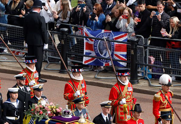 LONDON, ENGLAND - SEPTEMBER 19: The Queen's funeral cortege borne on the State Gun Carriage of the Royal Navy travels along The Mall with the Gentlemen at Arms on September 19, 2022 in London, England. Elizabeth Alexandra Mary Windsor was born in Bruton Street, Mayfair, London on 21 April 1926. She married Prince Philip in 1947 and ascended the throne of the United Kingdom and Commonwealth on 6 February 1952 after the death of her Father, King George VI. Queen Elizabeth II died at Balmoral Castle in Scotland on September 8, 2022, and is succeeded by her eldest son, King Charles III.  (Photo by Chip Somodevilla/Getty Images)