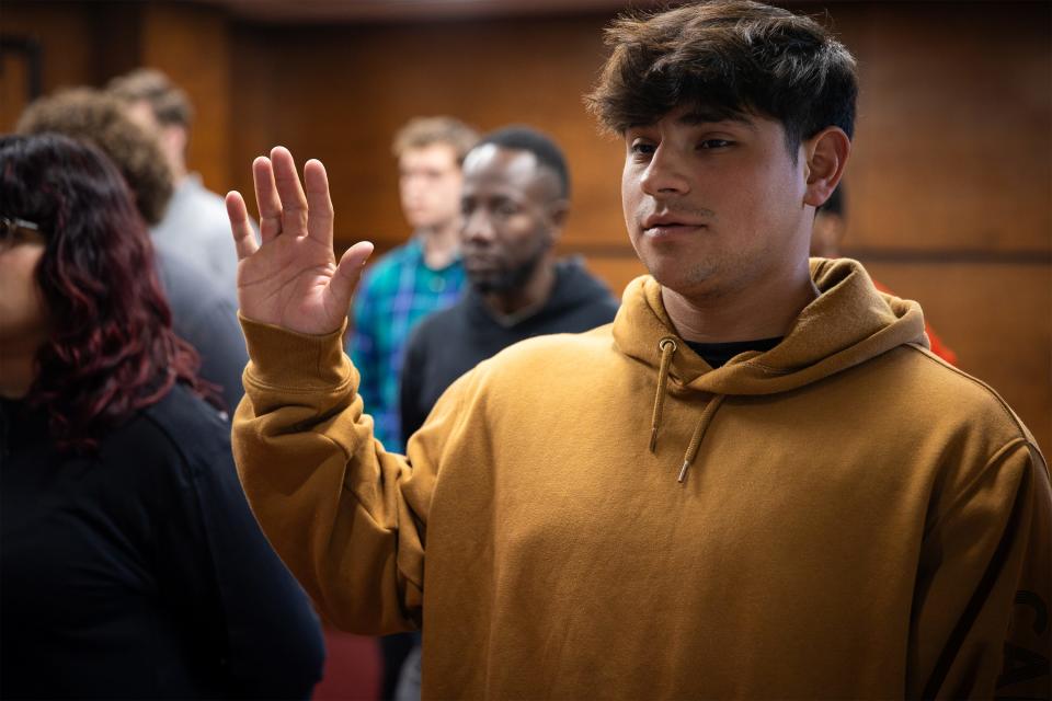 Frankee Fuenes Rutihea, a new recruit for the Alabama Army National Guard, swears in at during a ceremony at Military Entrance Processing Stations (MEPS), March 22, 2023.