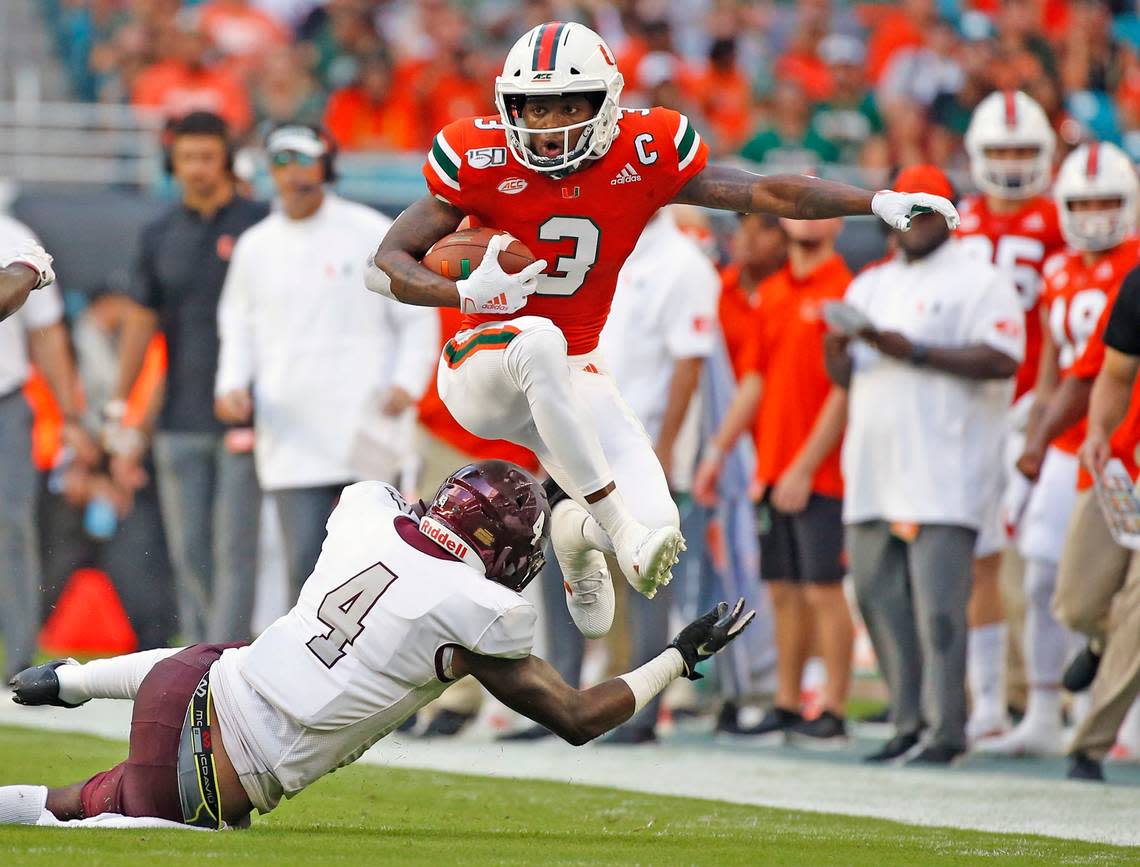 Miami Hurricanes wide receiver Mike Harley (3) leaps over Bethune Cookman Wildcats cornerback De’Ron Maxwell (4) in the second quarter as the University of Miami Hurricanes host Bethune-Cookman Wildcats at Hard Rock Stadium in Miami Gardens on Saturday, September 14, 2019.