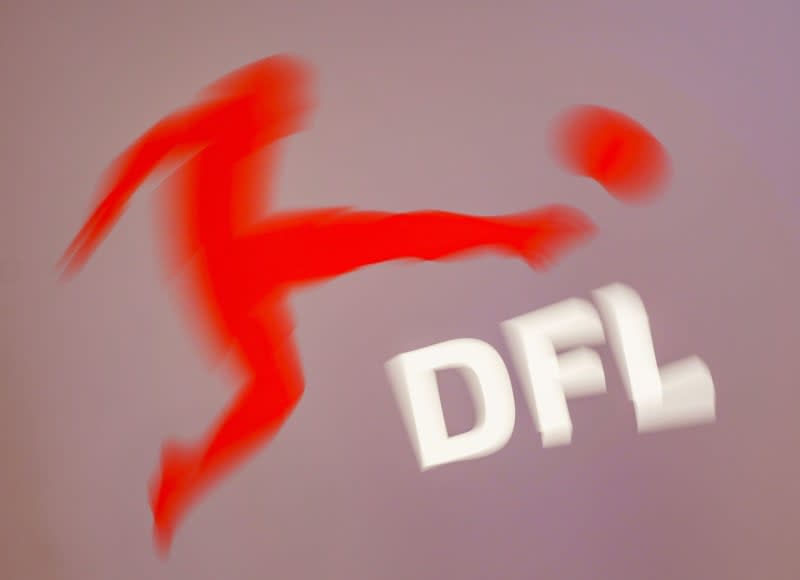 The Deutsche Fußball Liga 'German Football League'(DFL) logo pictred on a screen during a DFL general meeting at the Wiesbaden Congress Center. DFL top official are set to meet over the recruitment of an investor amid ongoing fan protests and calls from clubs for a new vote, dpa has learnt. Frank Rumpenhorst/dpa