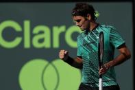 Mar 30, 2017; Miami, FL, USA; Roger Federer of Switzerland reacts after winning a point against Tomas Berdych of the Czech Republic (not pictured) in a men's singles quarter-final during the 2017 Miami Open at Crandon Park Tennis Center. Federer won 6-2, 3-6, 7-6(6). Mandatory Credit: Geoff Burke-USA TODAY Sports