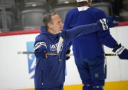 Tampa Bay Lightning head coach Jon Cooper directs players in drills during an NHL hockey practice before Game 1 of the Stanley Cup Finals against the Colorado Avalanche, Tuesday, June 14, 2022, in Denver. (AP Photo/David Zalubowski)