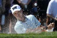 Eric Cole hits from a bunker onto the third green during the final round of the Honda Classic golf tournament, Sunday, Feb. 26, 2023, in Palm Beach Gardens, Fla. (AP Photo/Lynne Sladky)