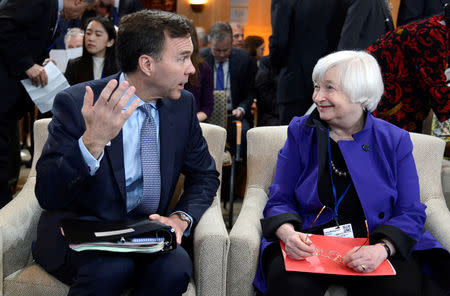 Canada's Finance Minister Bill Morneau (L) chats with Federal Reserve Board Chairperson Janet Yellen before the start of the International Monetary and Financial Committee (IMFC) meeting, as part of the IMF and World Bank's 2017 Annual Spring Meetings, in Washington, U.S., April 22, 2017. REUTERS/Mike Theiler