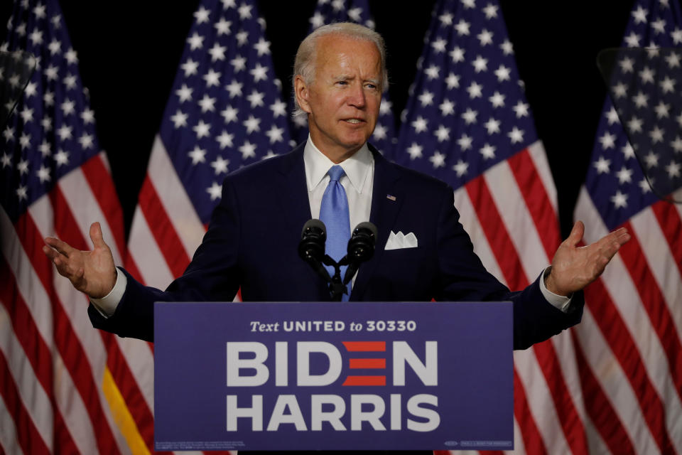 Democratic presidential candidate and former Vice President Joe Biden gestures as he speaks at a campaign event, on his first joint appearance with Vice presidential candidate Senator Kamala Harris after being named his running mate, at Alexis Dupont High School in Wilmington, Delaware, U.S., August 12, 2020. REUTERS/Carlos Barria    ?