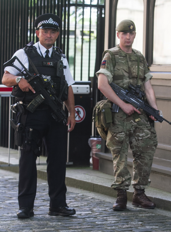 Soldiers are stationed at Downing Street in the aftermath of the Manchester attacks (Picture: REX)