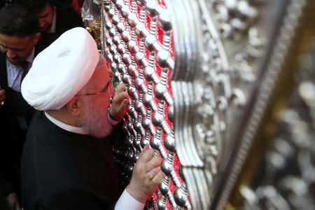 Iranian President Hassan Rouhani visits the Imam Ali shrine in Najaf, Iraq March 13, 2019. Official Iranian President website/Handout via REUTERS