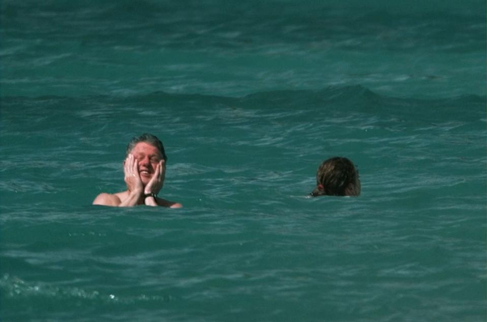 'I'm so happy to be swimming!" Clinton seems to say in this 1998 St. Thomas vacation photo.   (PAUL J. RICHARDS/AFP/Getty Images)