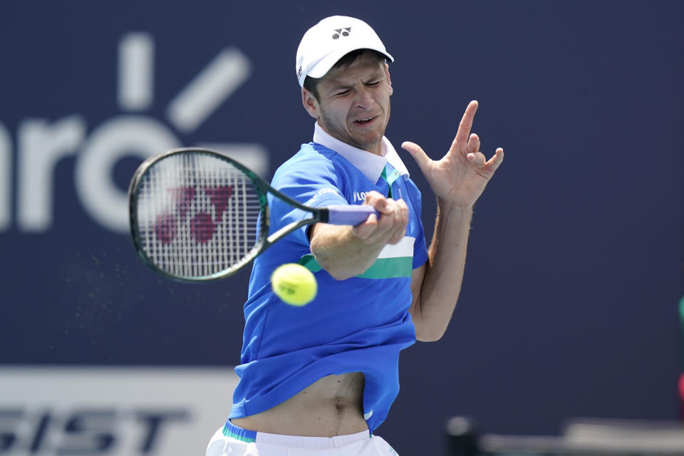 Hubert Hurkacz of Poland returns to Yannik Sinner of Italy during the finals of the Miami Open tennis tournament, Sunday, April 4, 2021, in Miami Gardens, Fla. Hurkacz won 7-6 (4), 6-4. (AP Photo/Lynne Sladky)