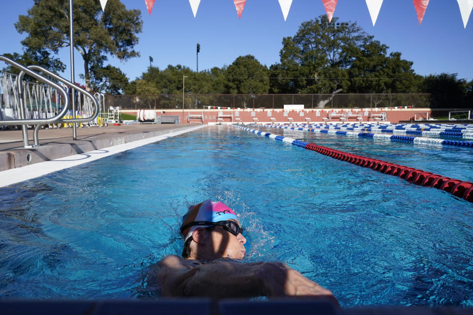 Stanford women's basketball head coach Tara VanDerveer swims in the school's Olympic-size pool in Stanford, Calif., Wednesday, Nov. 16, 2022. At 69 and the winningest women's basketball coach all-time, VanDerveer mixes up her activities to stay in top condition. She is a smooth swimmer who keeps a steady pace, freestyle the whole way. No breaks until she's done. (AP Photo/Godofredo A. Vásquez)